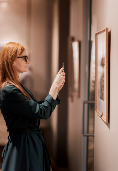 a art manager maison helya takes a photo of a work to offer it to her client